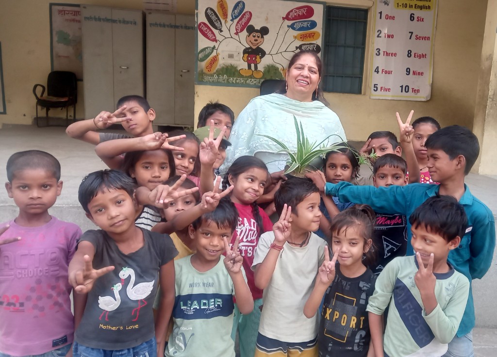 Padachihne Trust - Our Vision - Teacher and children in educational setting